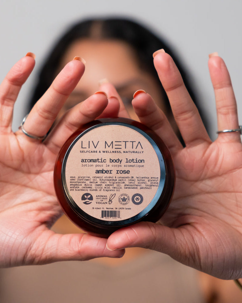 Amber Jar in hands , face in the background