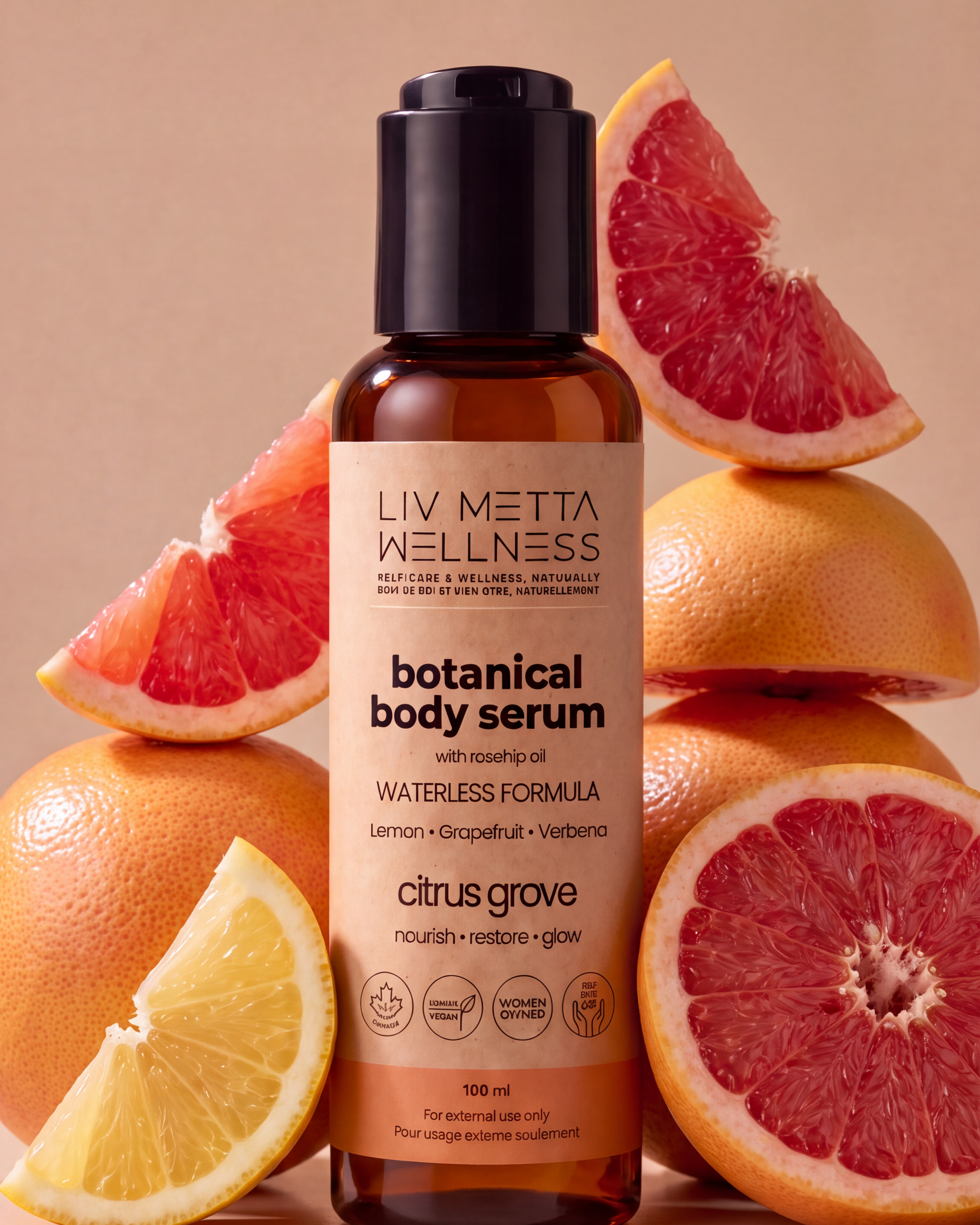A bottle of Liv Metta Wellness Botanical Body Serum in Citrus Grove scent, styled with fresh grapefruit and lemon slices on a warm beige background.