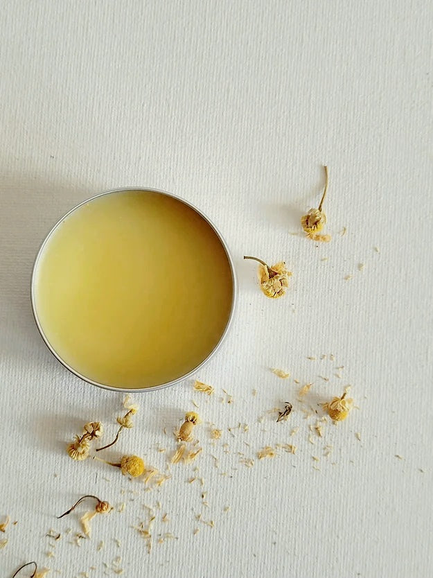 Body Balm in a tin on a white backdrop