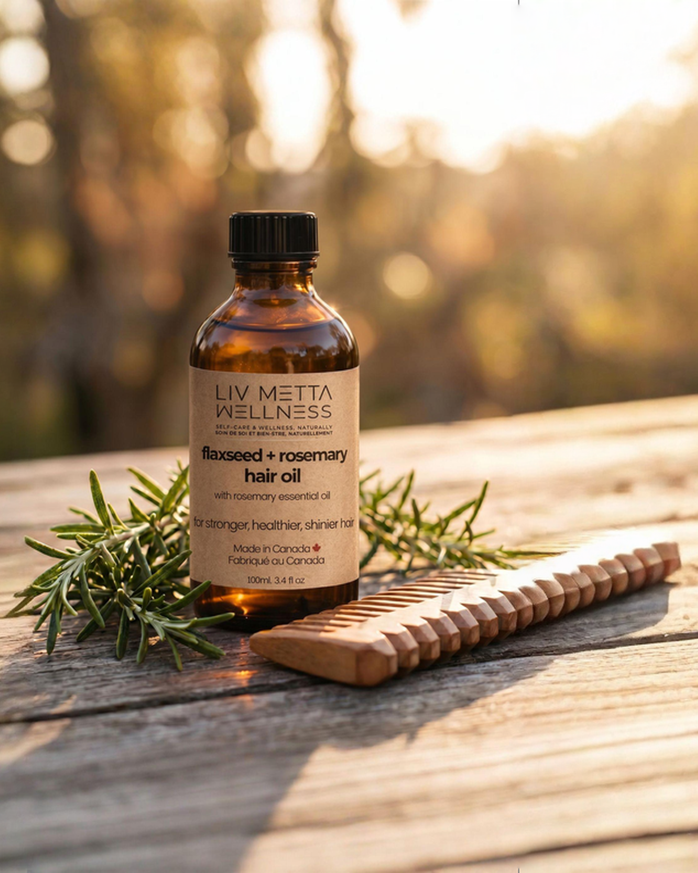 Bottle of Lavista Wellness Rosemary + Rosemary Hair Oil on a wooden surface with a natural background